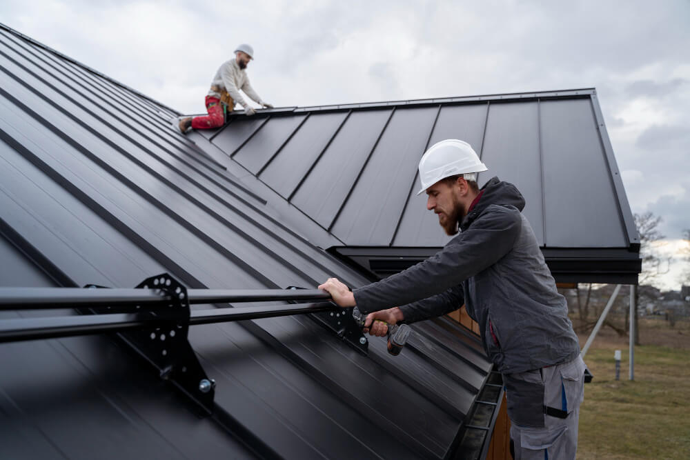 roofers installing the metal roof