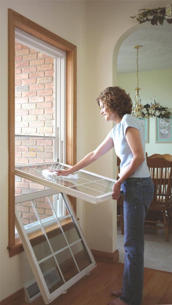 woman wiping the window